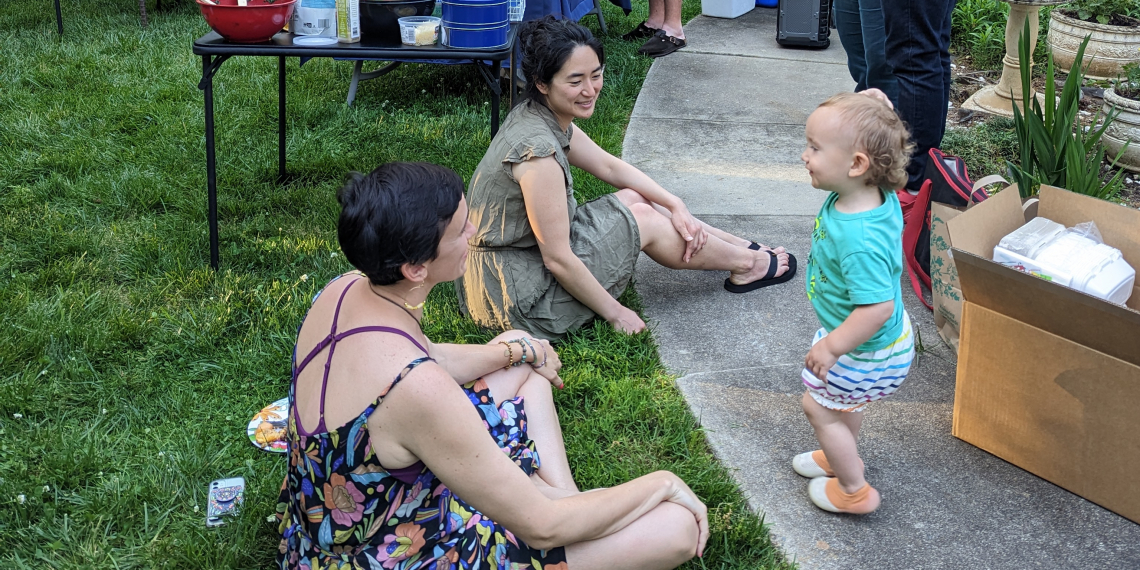 Jenn and Shanna speaking with an adorable partygoer. 