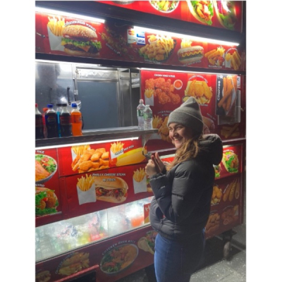 Laura Soter happily ordering a well deserved post-presentation gyro.